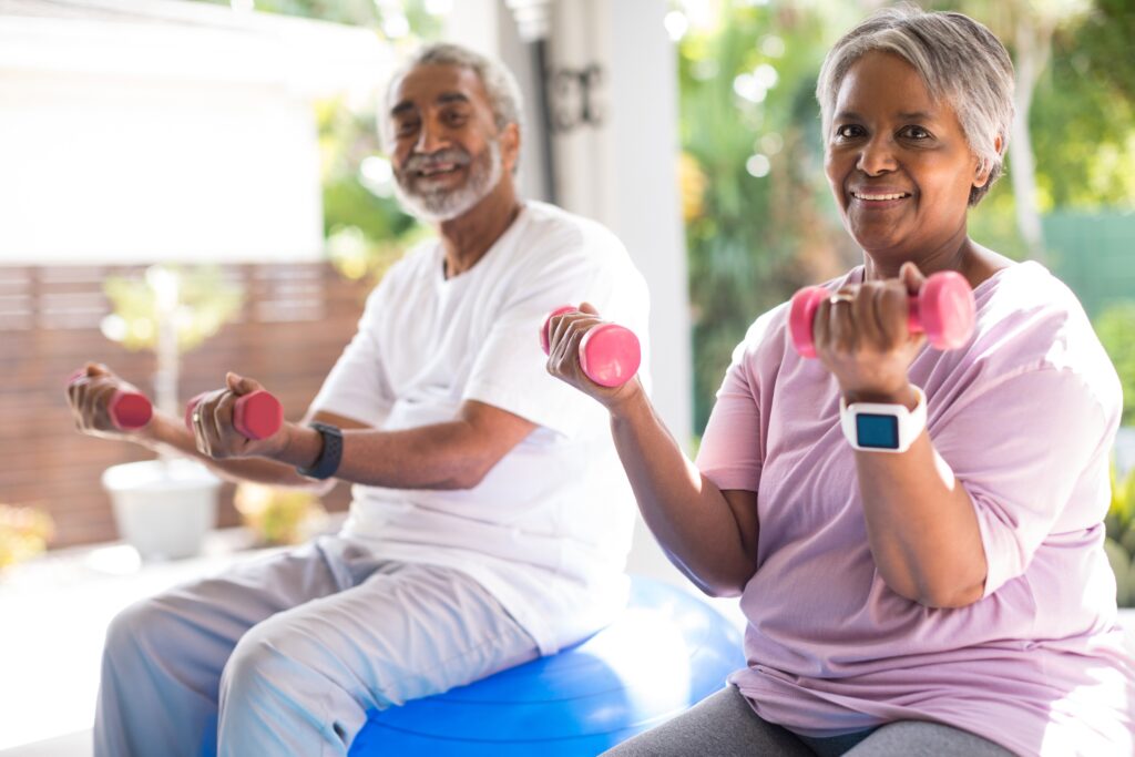 Older couple doing light cardio exercises for better general and sexual health