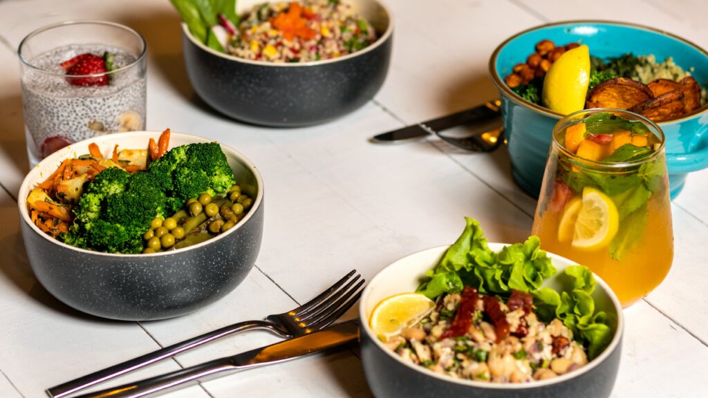 An assortment of healthy meals and drinks signifying the importance of incorporating a healthy diet for erectile dysfunction improvement