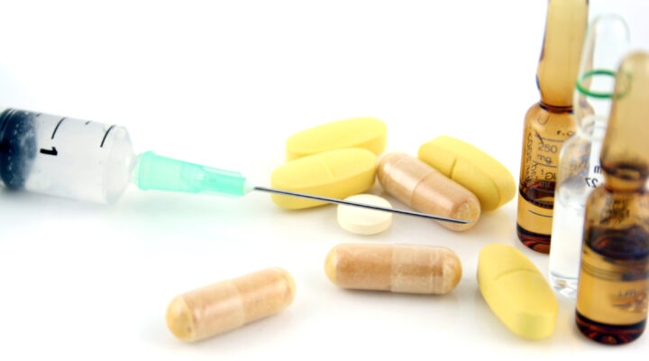 syringe and pills
