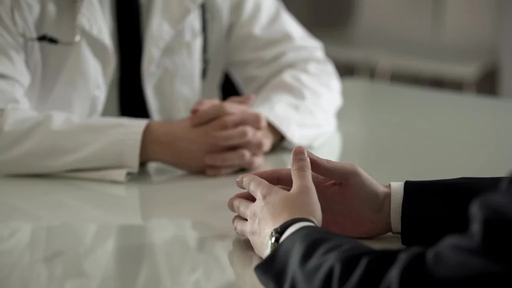 Man talking to a doctor